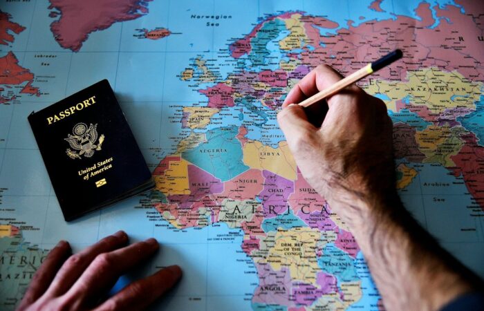 a person is writing on a map with a pencil