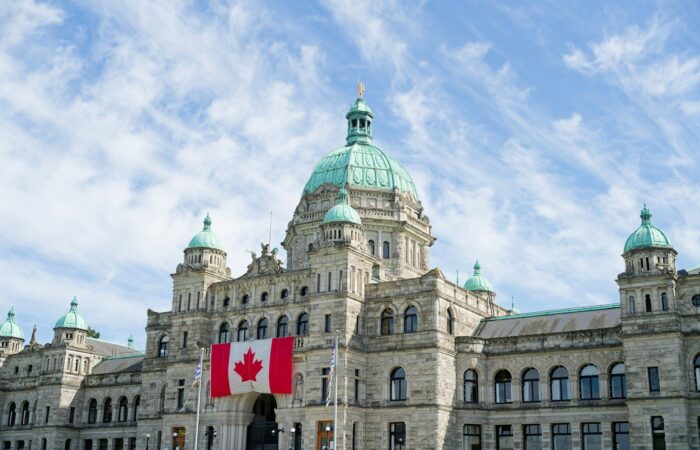 The british columbia parliament buildings display the canadian flag.